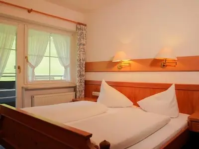 Ein Bett oder Betten in einem Zimmer der Unterkunft Gästehaus Annette