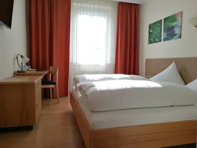 Ein Bett oder Betten in einem Zimmer der Unterkunft Der Löwen, Löwen Betriebs- und Management GmbH