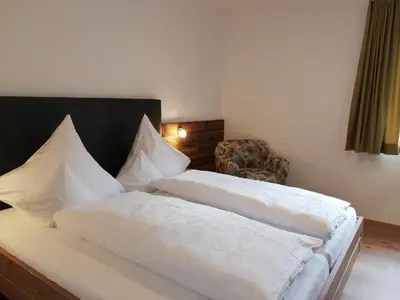 Ein Bett oder Betten in einem Zimmer der Unterkunft Ferienwohnung Anton Künzler