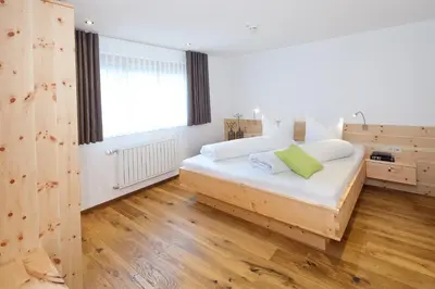 Ein Bett oder Betten in einem Zimmer der Unterkunft Aparthotel Brunnenhof