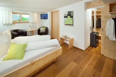 Ein Bett oder Betten in einem Zimmer der Unterkunft Aparthotel Brunnenhof