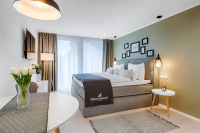 Ein Bett oder Betten in einem Zimmer der Unterkunft Business Hotel Maier