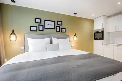 Ein Bett oder Betten in einem Zimmer der Unterkunft Business Hotel Maier