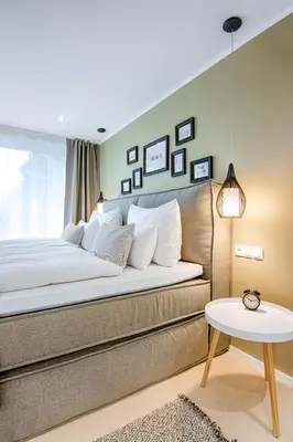 Ein Bett oder Betten in einem Zimmer der Unterkunft Business Hotel Maier