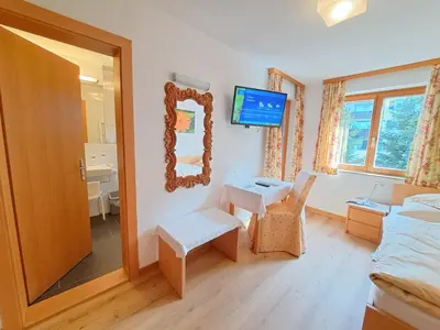 Ein Bett oder Betten in einem Zimmer der Unterkunft Pension Mallaun