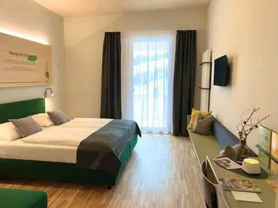 Ein Bett oder Betten in einem Zimmer der Unterkunft JUFA Hotel Laterns - Klangholzhus