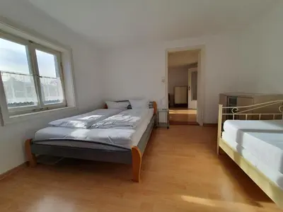 Ein Bett oder Betten in einem Zimmer der Unterkunft Helene Hohenems, 4-12 P, Haus, 4 Schlafzimmer, Küche, Parkplatz, Garten, Wifi