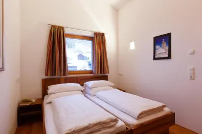 Ein Bett oder Betten in einem Zimmer der Unterkunft Alpenappartement Bergkönig