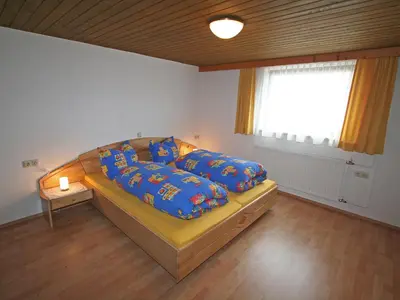 Ein Bett oder Betten in einem Zimmer der Unterkunft Apartment Mangeng-1 by Interhome