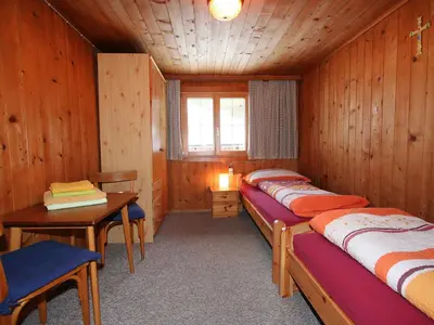 Ein Bett oder Betten in einem Zimmer der Unterkunft Apartment Mangeng-2 by Interhome