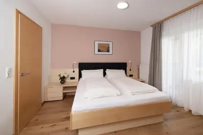 Ein Bett oder Betten in einem Zimmer der Unterkunft Gästehaus Manuela Puchmayr