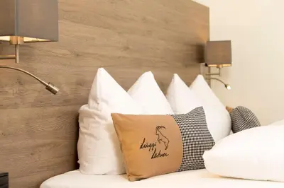 Ein Bett oder Betten in einem Zimmer der Unterkunft Haus Garni Luggi Leitner