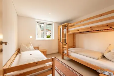 Ein Bett oder Betten in einem Zimmer der Unterkunft Haus Emilia am Faschinajoch