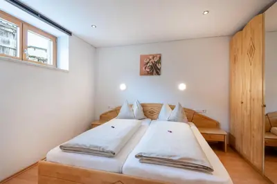 Ein Bett oder Betten in einem Zimmer der Unterkunft Haus Emilia am Faschinajoch