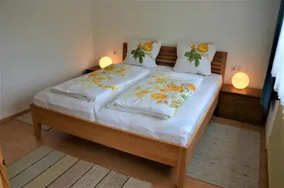 Ein Bett oder Betten in einem Zimmer der Unterkunft Ferienwohnung Walgaublick