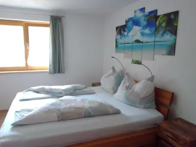 Ein Bett oder Betten in einem Zimmer der Unterkunft Ferienwohnung Maari