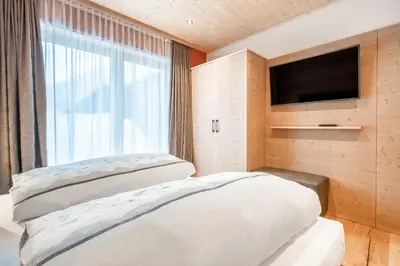 Ein Bett oder Betten in einem Zimmer der Unterkunft Naturhaus am Arlberg