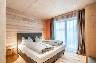 Ein Bett oder Betten in einem Zimmer der Unterkunft Naturhaus am Arlberg