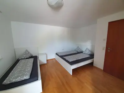Ein Bett oder Betten in einem Zimmer der Unterkunft Ferienwohnung Anjele