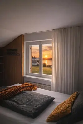 Ein Bett oder Betten in einem Zimmer der Unterkunft Haus Bregenz Apartment Festspiele