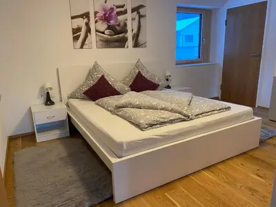 Ein Bett oder Betten in einem Zimmer der Unterkunft Ferienwohnung Übelher