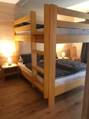 Ein Bett oder Betten in einem Zimmer der Unterkunft Ferienwohnung Schnetzer Au