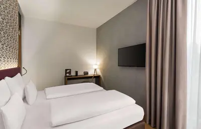 Ein Bett oder Betten in einem Zimmer der Unterkunft Amedia Lustenau, Trademark Collection by Wyndham