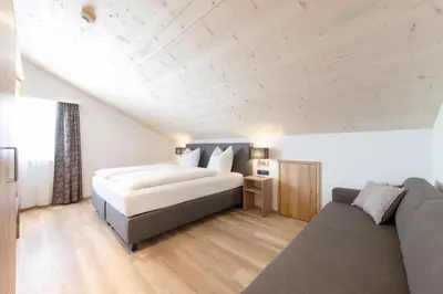 Ein Bett oder Betten in einem Zimmer der Unterkunft tannberg LODGE