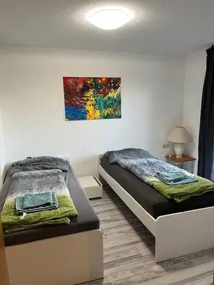 Ein Bett oder Betten in einem Zimmer der Unterkunft Dimai House No 17 Dornbirn Zentrum