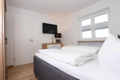 Ein Bett oder Betten in einem Zimmer der Unterkunft Gästehaus Scherrer