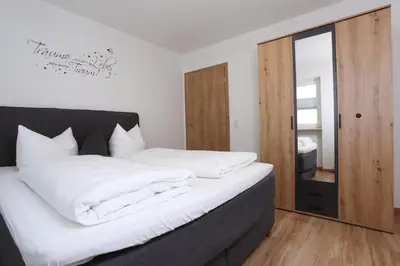 Ein Bett oder Betten in einem Zimmer der Unterkunft Gästehaus Scherrer