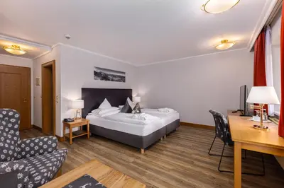 Ein Bett oder Betten in einem Zimmer der Unterkunft IFA Alpenhof Wildental Hotel Kleinwalsertal Adults only