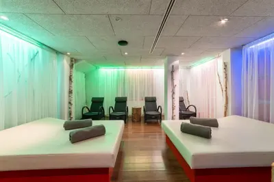 Ein Bett oder Betten in einem Zimmer der Unterkunft IFA Alpenhof Wildental Hotel Kleinwalsertal Adults only