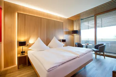 Ein Bett oder Betten in einem Zimmer der Unterkunft Hotel Schwärzler