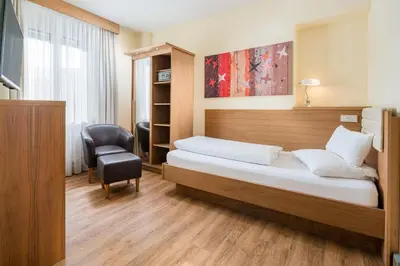 Ein Bett oder Betten in einem Zimmer der Unterkunft Hotel Weißes Kreuz