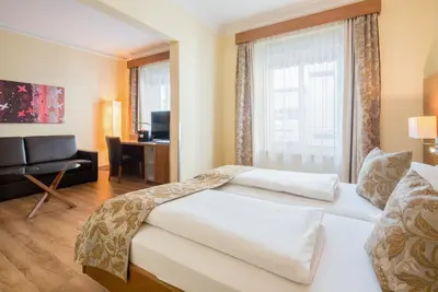 Ein Bett oder Betten in einem Zimmer der Unterkunft Hotel Weißes Kreuz