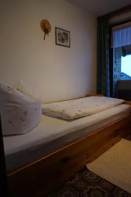 Ein Bett oder Betten in einem Zimmer der Unterkunft Gästehaus Metzler