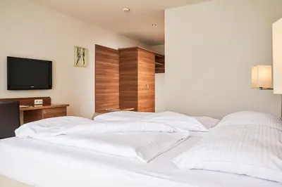Ein Bett oder Betten in einem Zimmer der Unterkunft Fairmotel Dornbirn