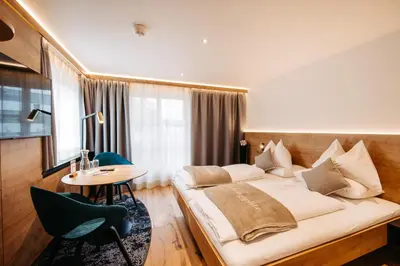 Ein Bett oder Betten in einem Zimmer der Unterkunft Sonne 1806 - Hotel am Campus Dornbirn