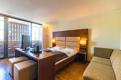 Ein Bett oder Betten in einem Zimmer der Unterkunft Sonne 1806 - Hotel am Campus Dornbirn