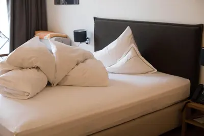 Ein Bett oder Betten in einem Zimmer der Unterkunft Hotel Restaurant Mohren