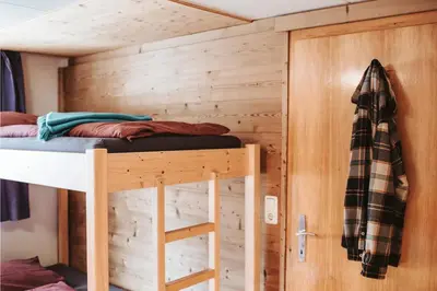 Ein Etagenbett oder Etagenbetten in einem Zimmer der Unterkunft Ferienhaus MAVI