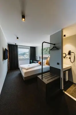 Ein Bett oder Betten in einem Zimmer der Unterkunft NIGHT INN Hotel Bahnhofcity Feldkirch