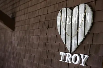 Ein Zertifikat, Auszeichnung, Logo oder anderes Dokument, das in der Unterkunft Ferienhaus Troy ausgestellt ist