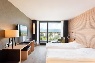 Ein Bett oder Betten in einem Zimmer der Unterkunft Hotel Weisses Kreuz