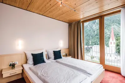 Ein Bett oder Betten in einem Zimmer der Unterkunft Hotel Adler