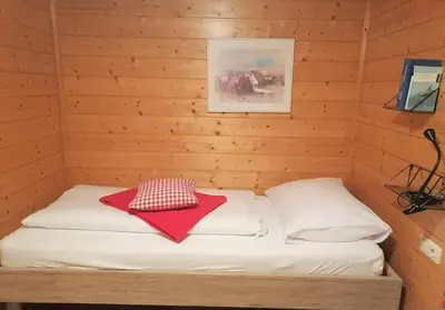 Ein Bett oder Betten in einem Zimmer der Unterkunft Ferienwohnung Brittenberg Alpaka