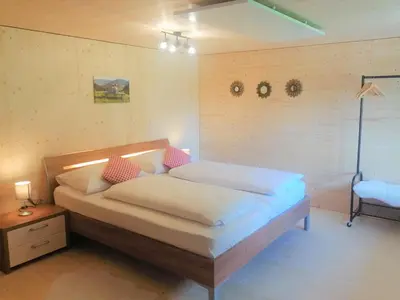 Ein Bett oder Betten in einem Zimmer der Unterkunft Ferienwohnung Brittenberg Alpaka