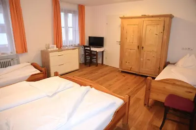 Ein Bett oder Betten in einem Zimmer der Unterkunft Hotel Andreas Hofer