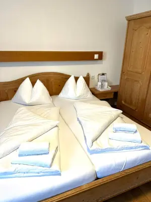 Ein Bett oder Betten in einem Zimmer der Unterkunft Hotel Andreas Hofer